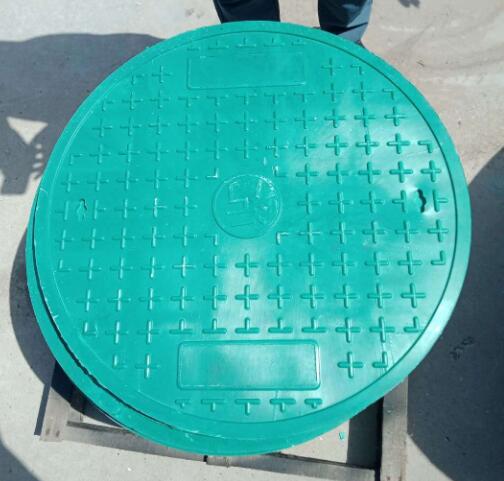 Green manhole cover